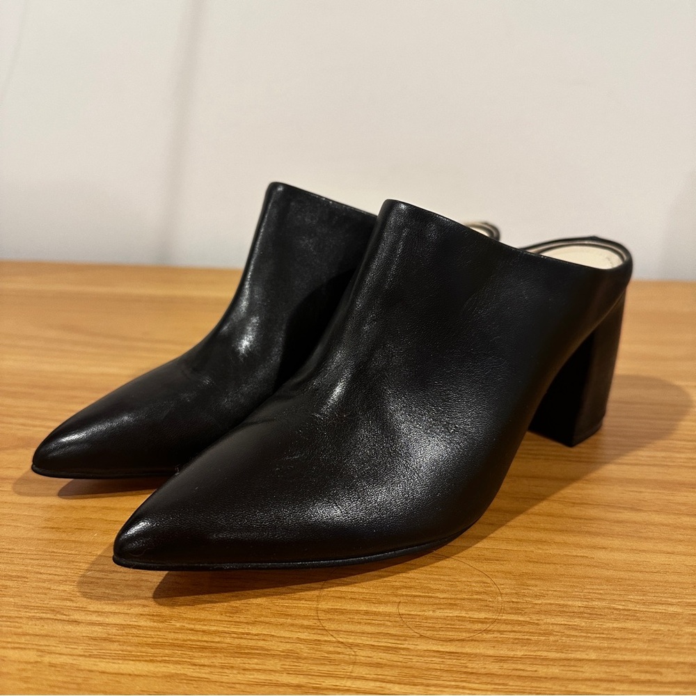 Marc Fisher black leather mules with pointed toe and block heel, size 7.5